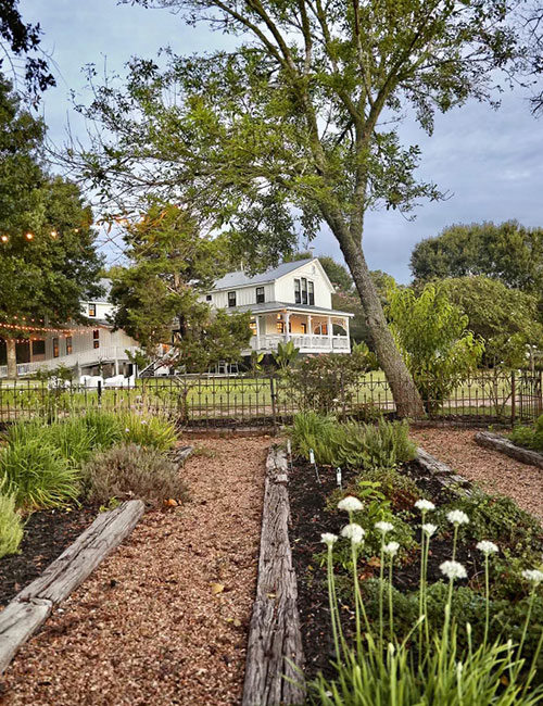 outdoor of the frenchie boutique hotel in round top texas